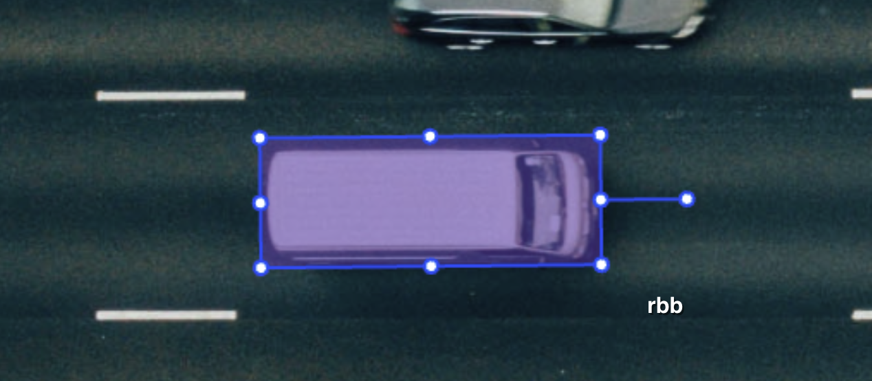 Rotated bounding box direction handle shown outside the box